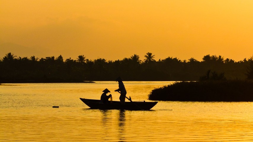 Boat on the river at sunset