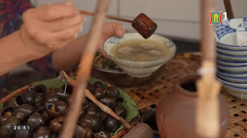 scooping the broth for dipping