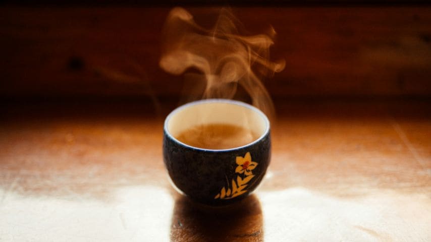 A steaming Japanese tea cup