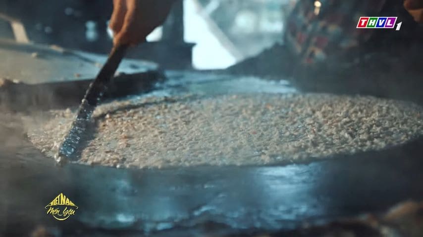 Spreading batter of coconut cracker